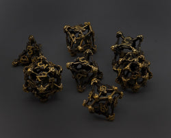 Gold Deadly Skull Dice Hollow Metal 7-Dice Set (Online Only)