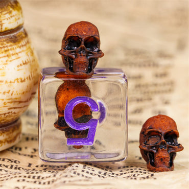 Orange Skull Dice | Clear RPG 7-Dice Set w/ Purple Numbers (Online Only)