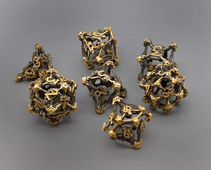 Gold Deadly Skull Dice Hollow Metal 7-Dice Set (Online Only)