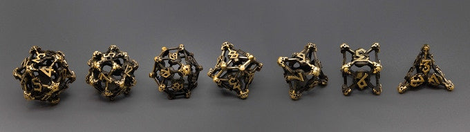 Gold Deadly Skull Dice Hollow Metal 7-Dice Set (Online Only)